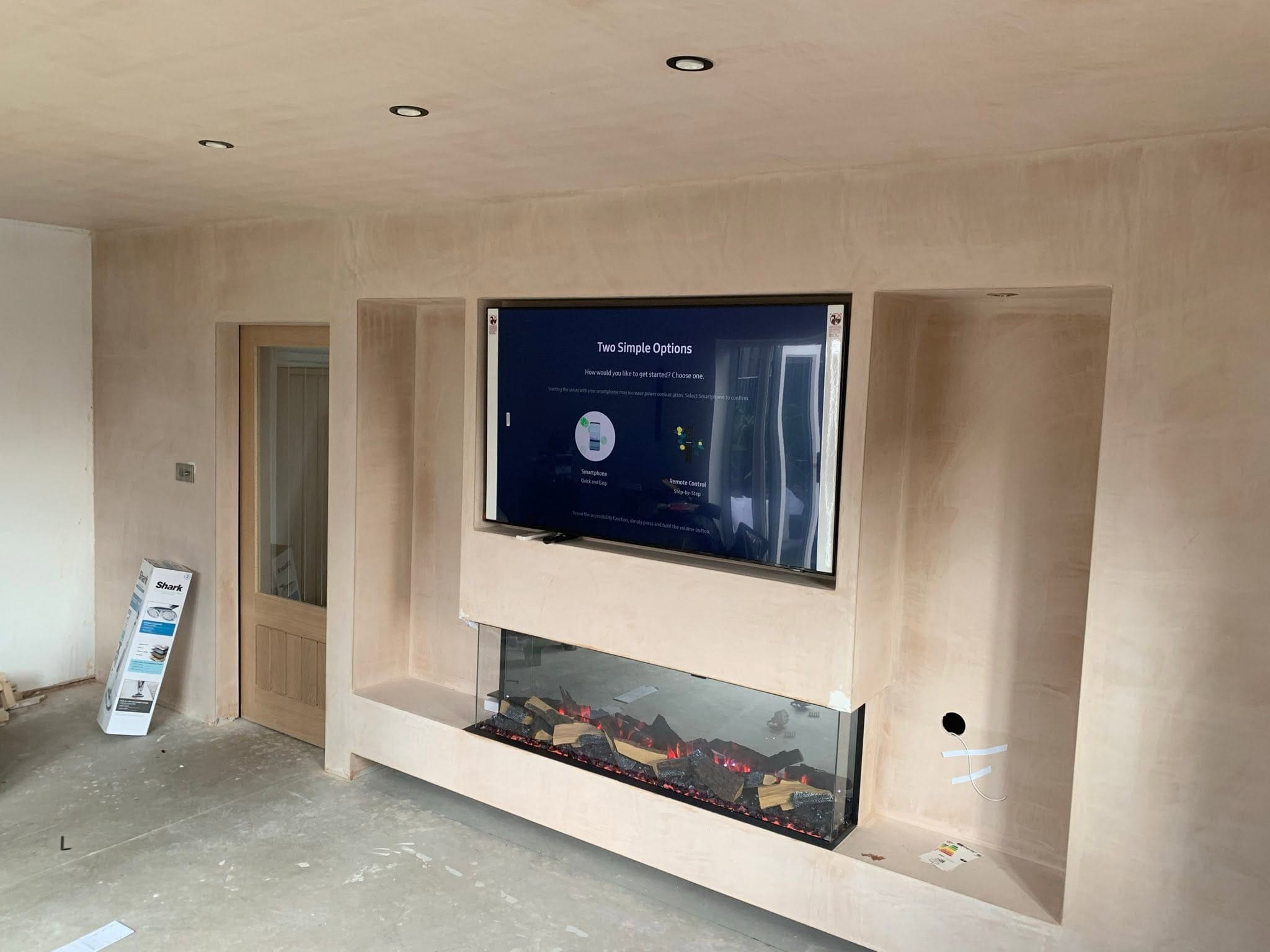 Do You Need an Electrician for a Media Wall? 2 integrated media wall and fireplace Media wall with a three-sided electric fire and shelving